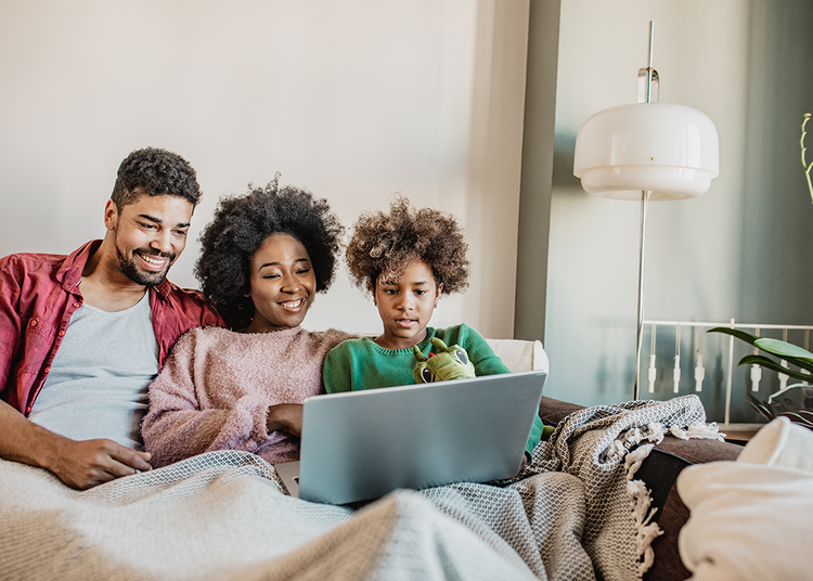 cozy-family-sitting-in-bed